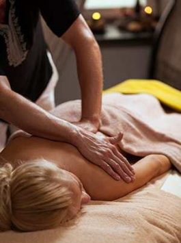 Young woman enjoys massage in a luxury spa